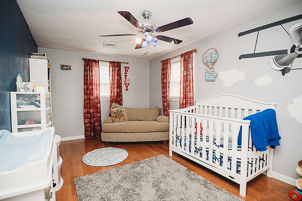 4448 Keefer Road Roanoke, VA 24018 - Photo 22 of 37 a bedroom with furniture and a large window