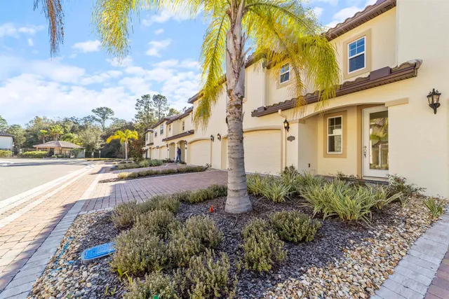 a view of a street with houses on both side