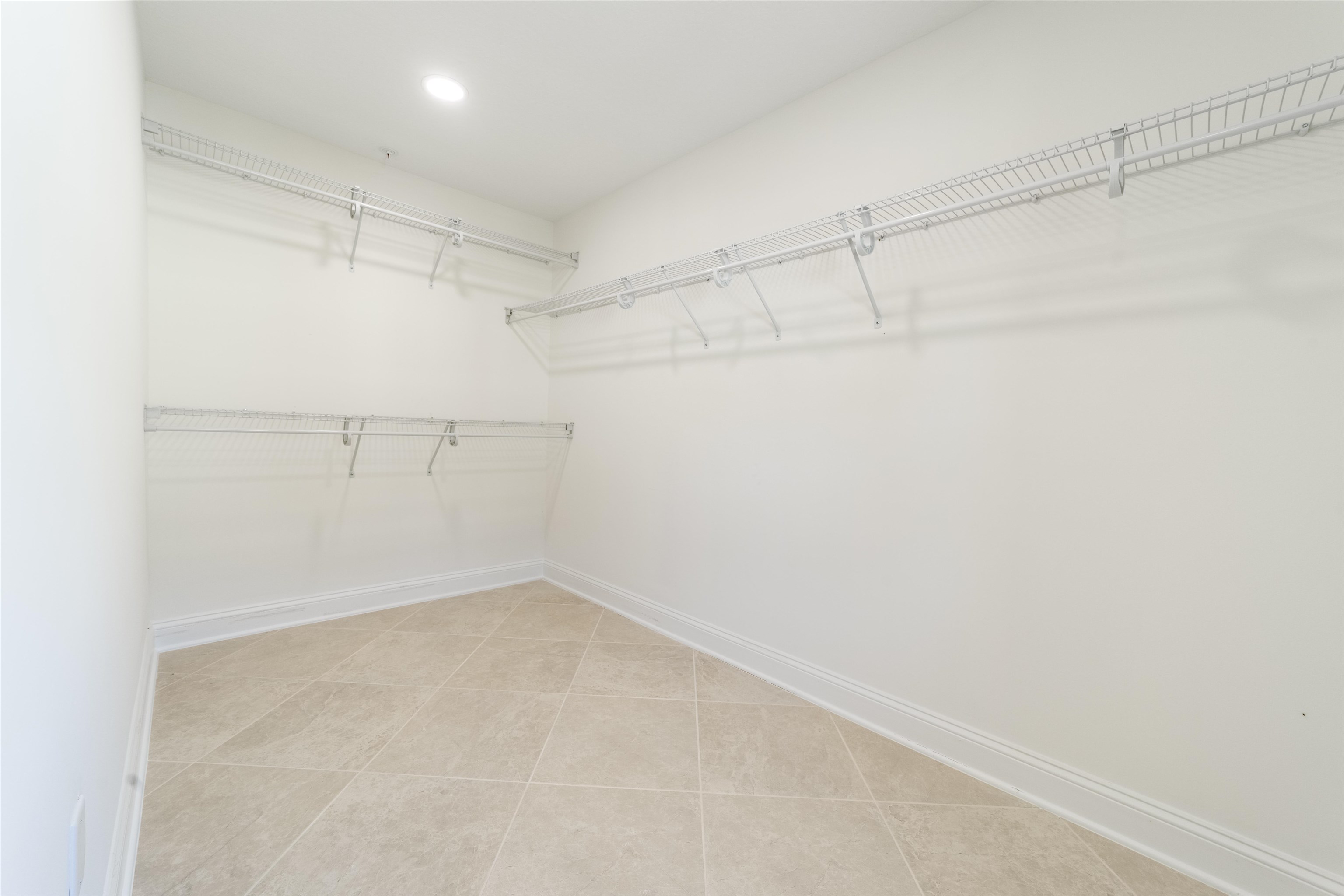 255 Grand Ravine Drive St. Augustine, FL 32086 - Photo 13 of 25 a view of a room with racks on the wall