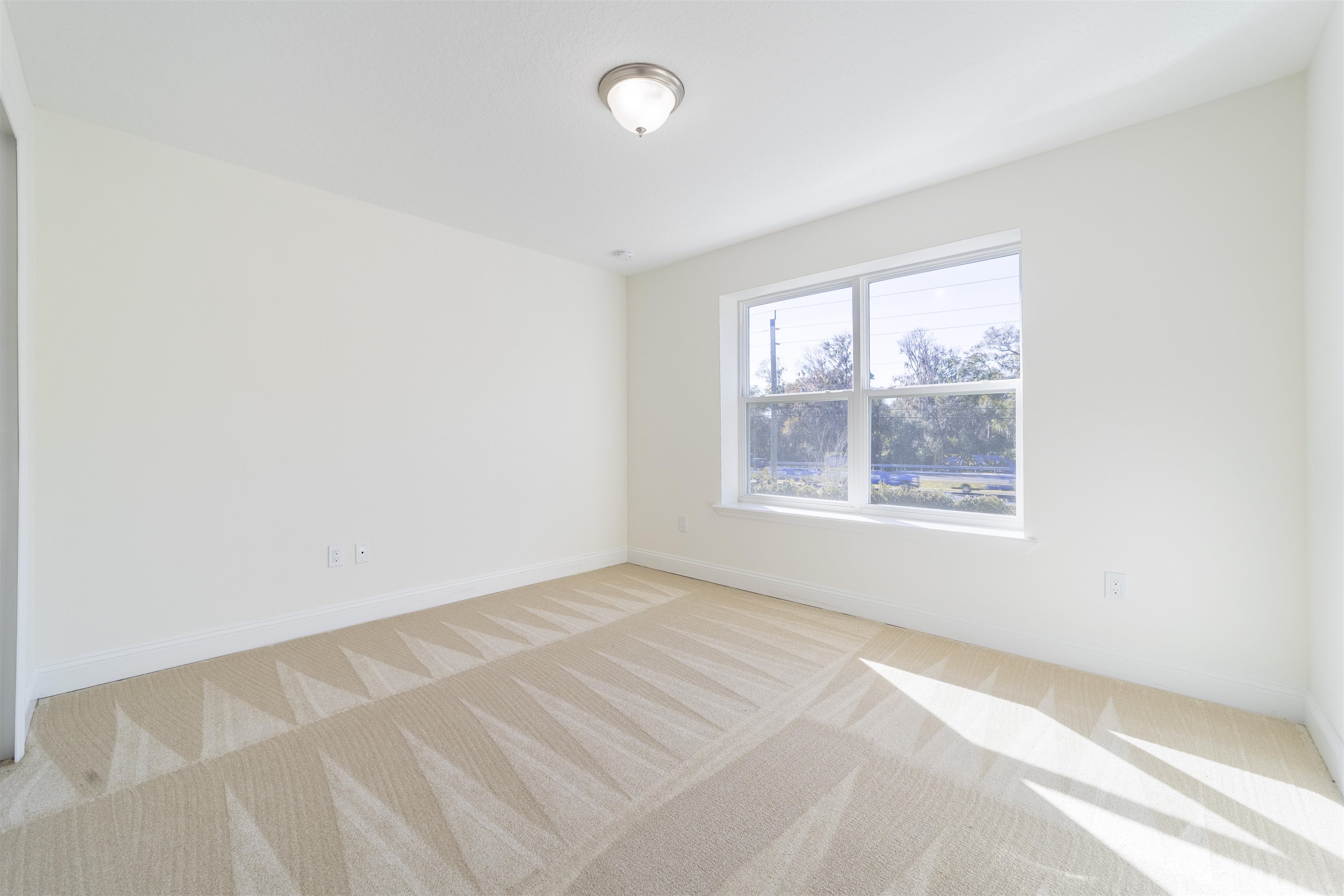255 Grand Ravine Drive St. Augustine, FL 32086 - Photo 15 of 25 an empty room with windows