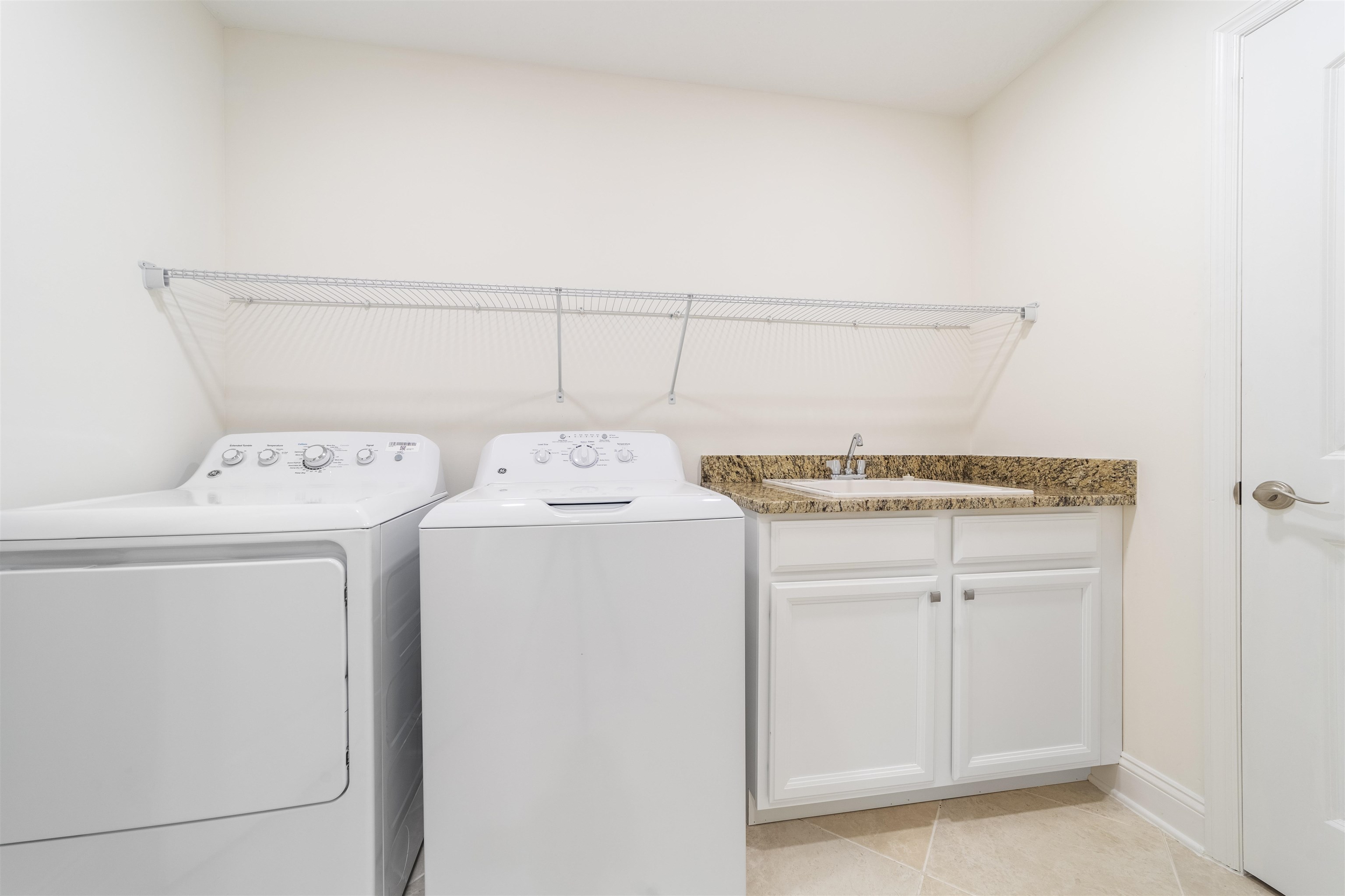 255 Grand Ravine Drive St. Augustine, FL 32086 - Photo 20 of 25 a utility room with dryer and washer