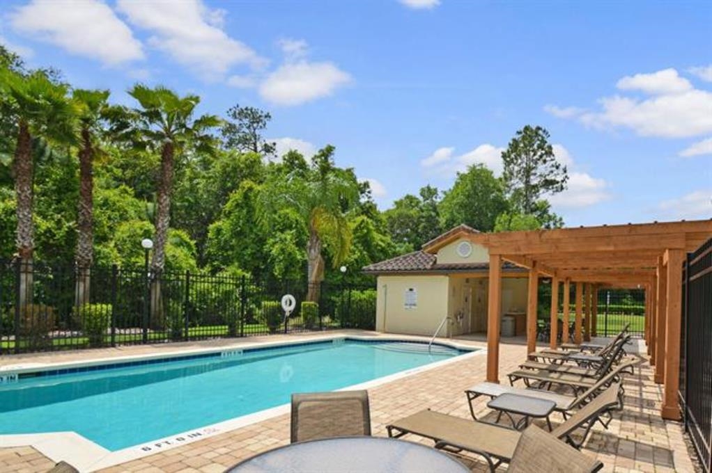 255 Grand Ravine Drive St. Augustine, FL 32086 - Photo 25 of 25 a view of a house with backyard sitting area and garden