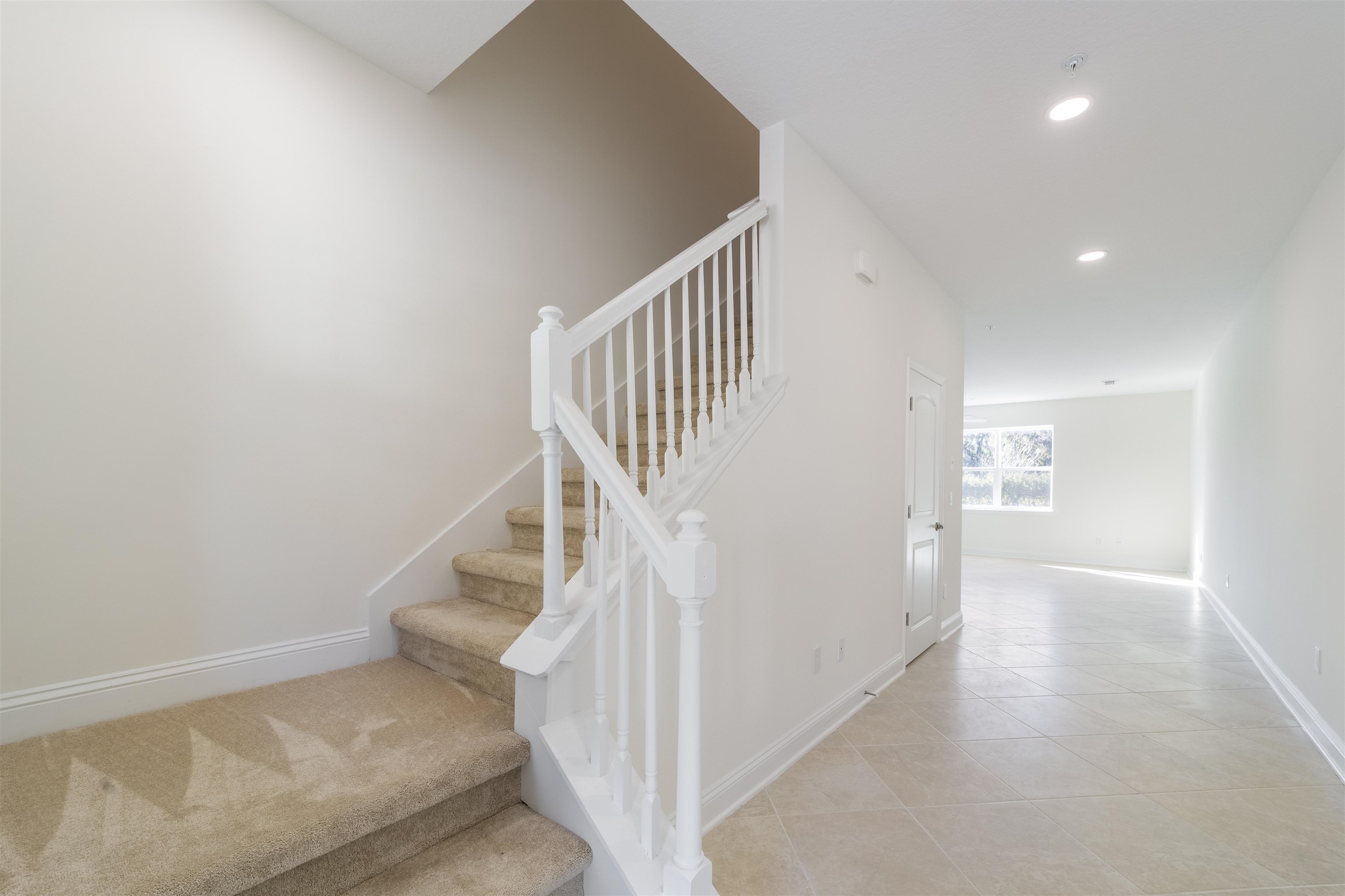 255 Grand Ravine Drive St. Augustine, FL 32086 - Photo 3 of 25 a view of a hallway with staircase