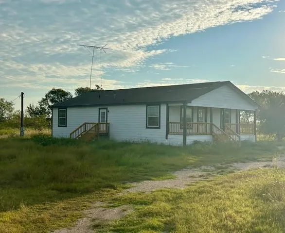 a view of a yard in front of a house