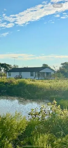 a view of a lake with a big yard
