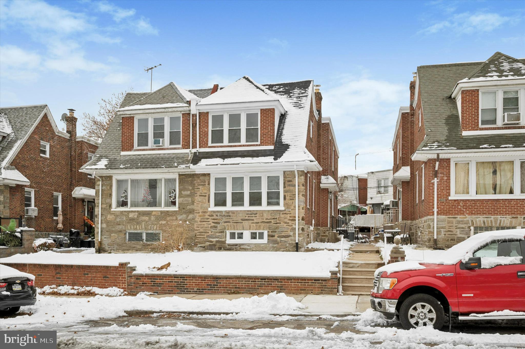 6866 North 19th Street Philadelphia, PA 19126 - Photo 1 of 28 a view of a car parked in front of a brick house
