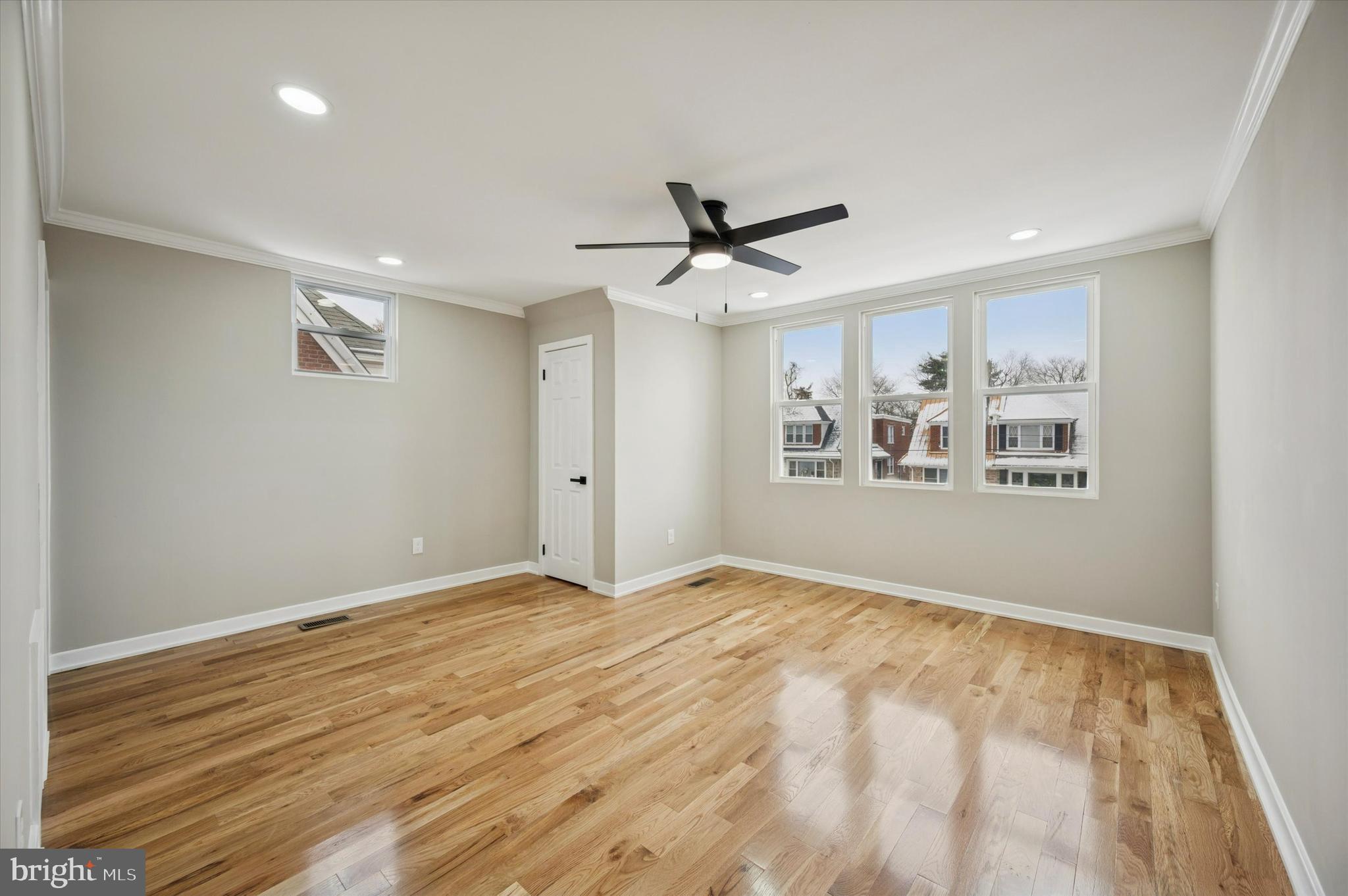 6866 North 19th Street Philadelphia, PA 19126 - Photo 15 of 28 a view of an empty room with window and wooden floor