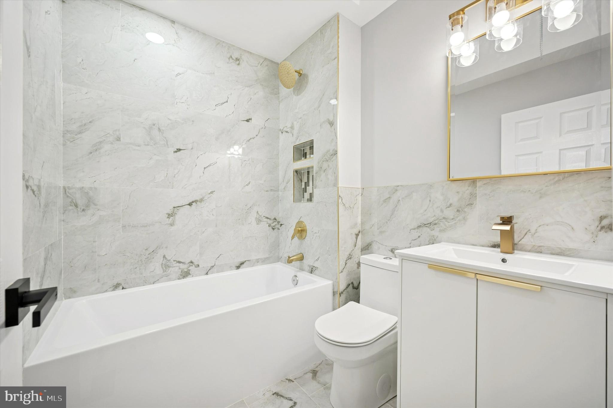 6866 North 19th Street Philadelphia, PA 19126 - Photo 19 of 28 a bathroom with a sink a toilet and bathtub
