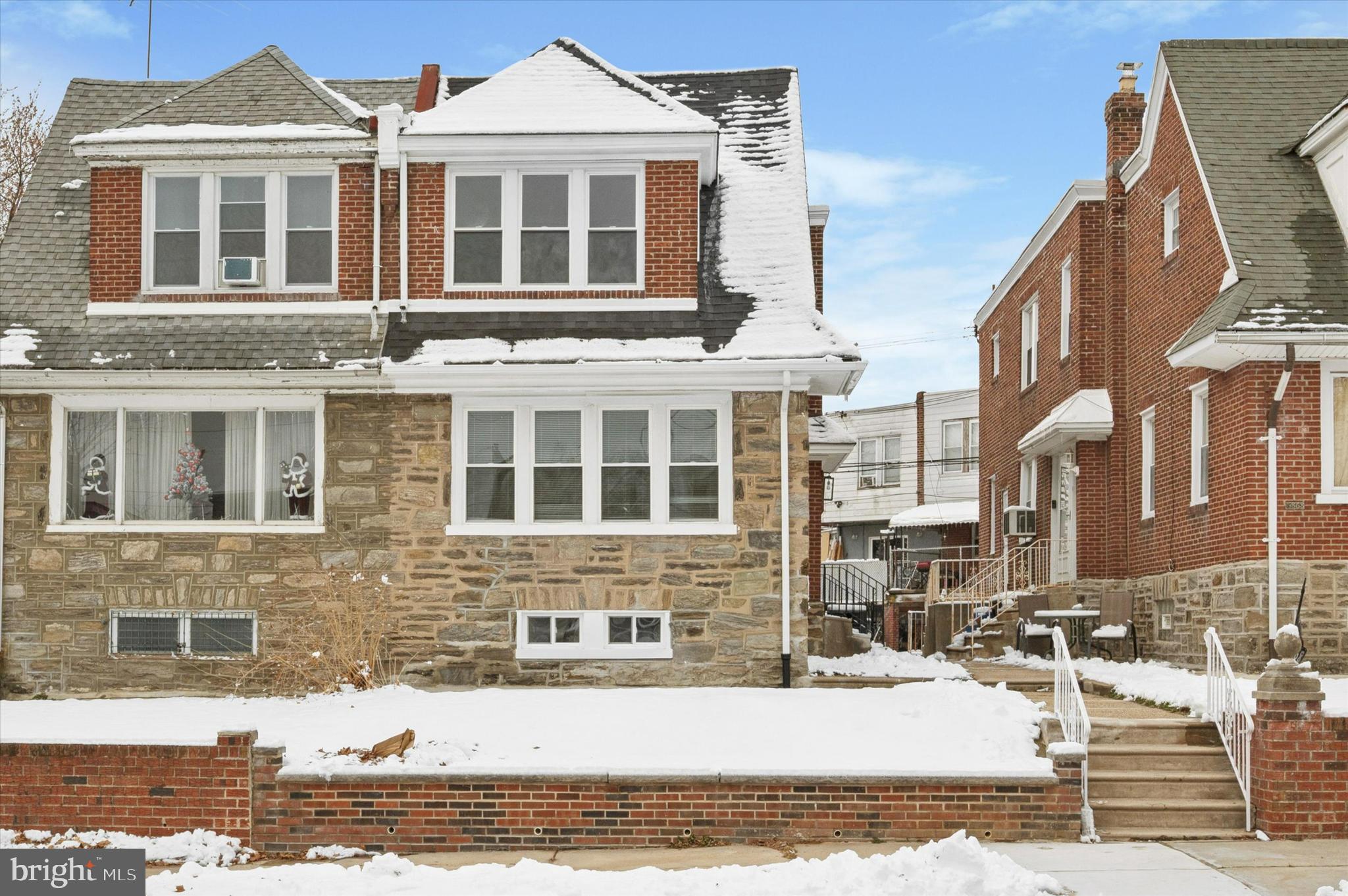 6866 North 19th Street Philadelphia, PA 19126 - Photo 2 of 28 a front view of a house with a yard