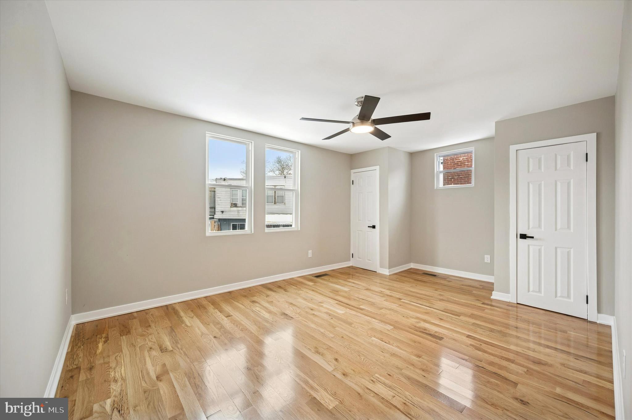 6866 North 19th Street Philadelphia, PA 19126 - Photo 21 of 28 a view of an empty room with wooden floor and a window