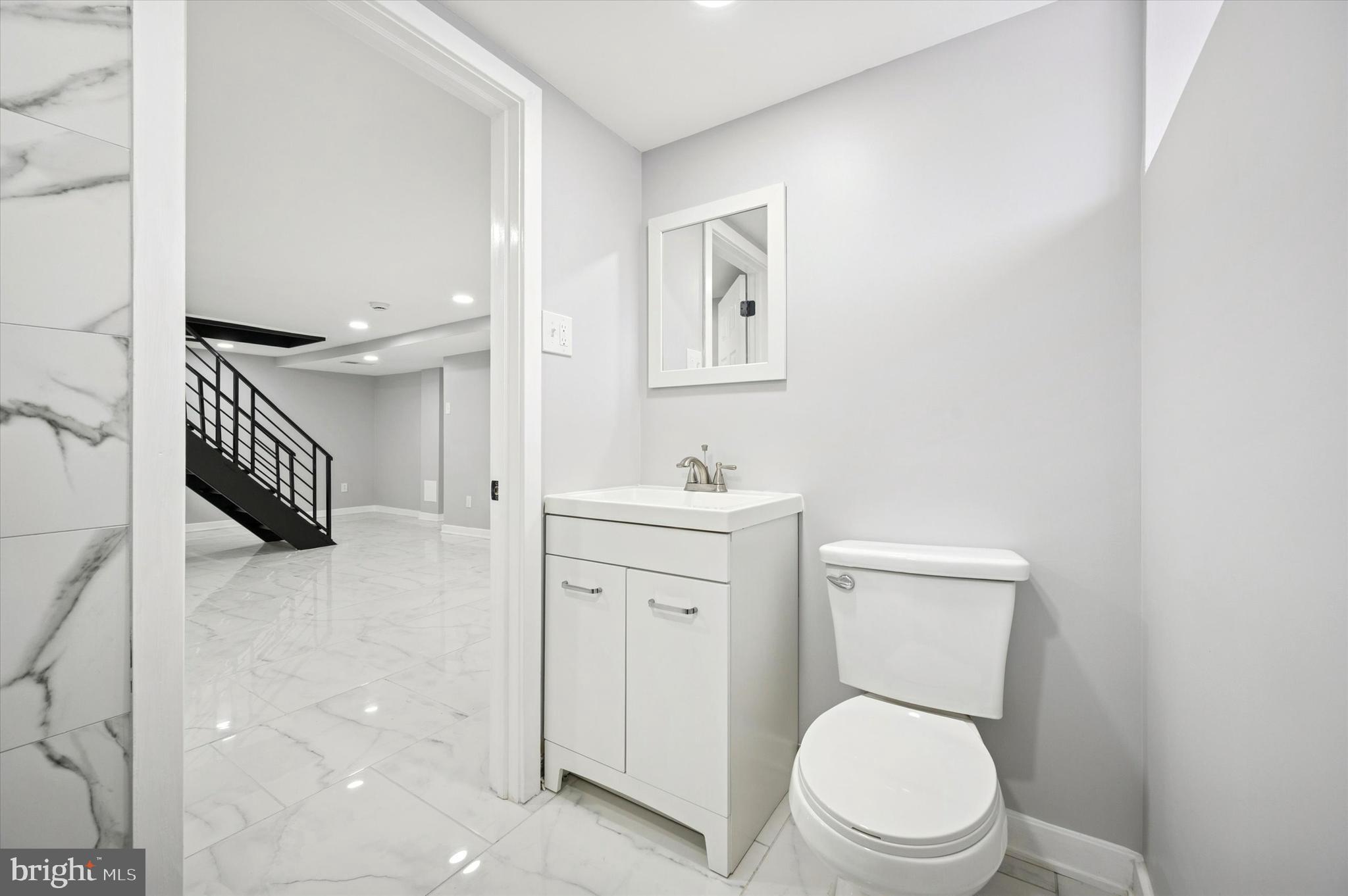 6866 North 19th Street Philadelphia, PA 19126 - Photo 24 of 28 a white toilet sitting next to a bathroom sink