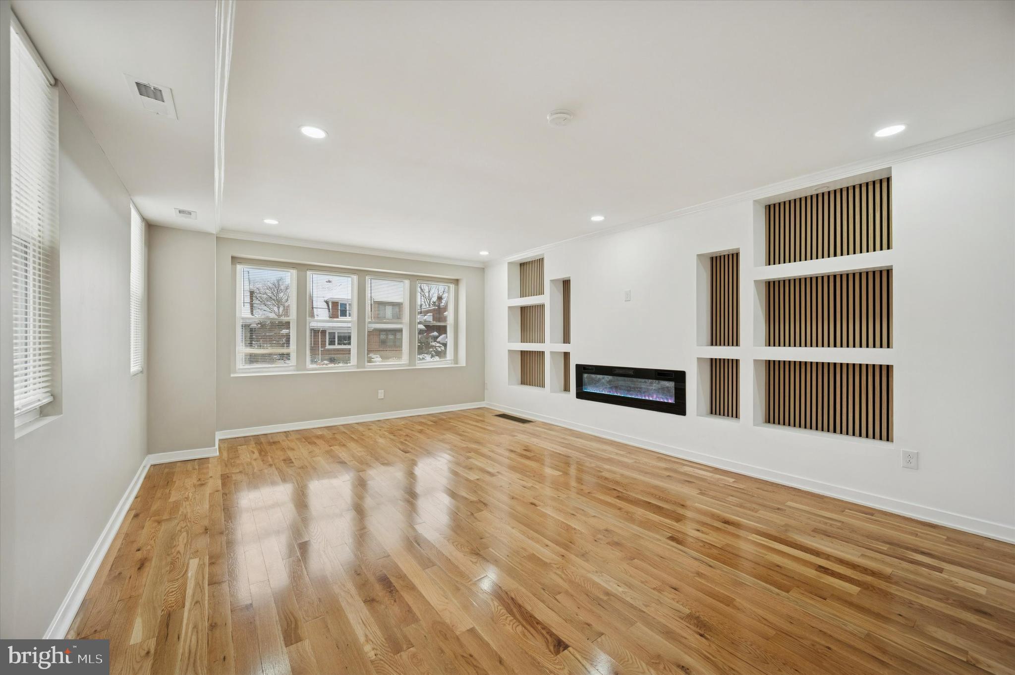 6866 North 19th Street Philadelphia, PA 19126 - Photo 5 of 28 a view of an empty room with a window and fireplace