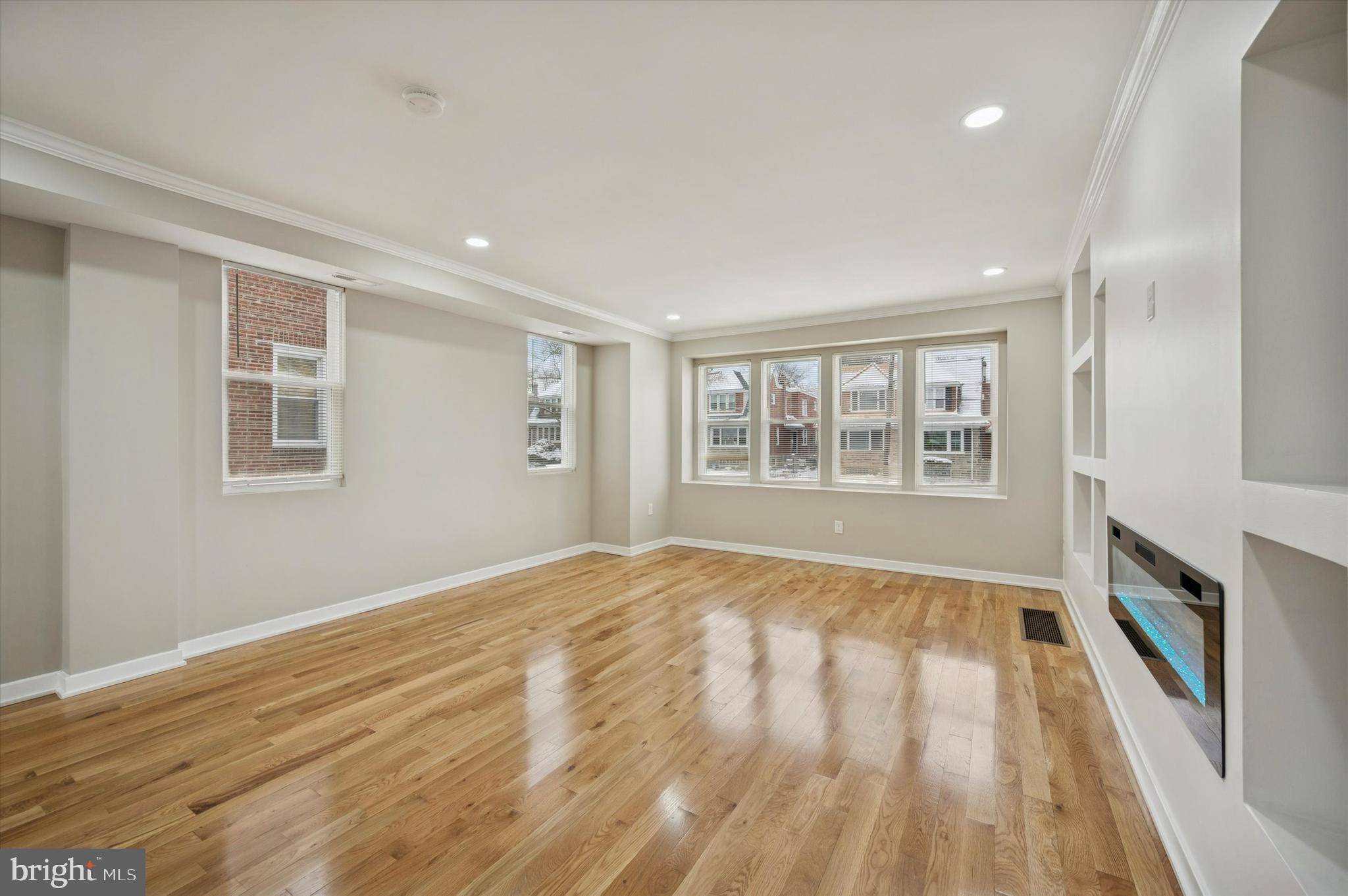 6866 North 19th Street Philadelphia, PA 19126 - Photo 6 of 28 a view of an empty room with a window and wooden floor