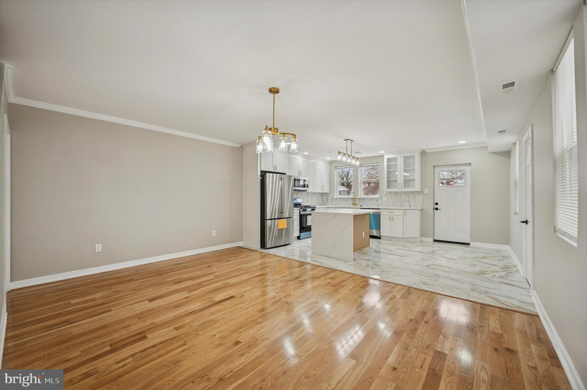 6866 North 19th Street Philadelphia, PA 19126 - Photo 8 of 28 a view of a kitchen with refrigerator and wooden floor
