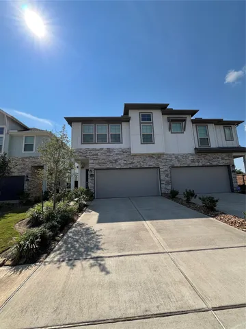 a front view of a house with yard