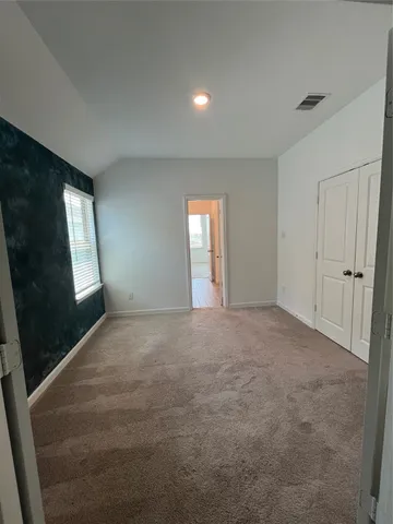 a view of an empty room and window