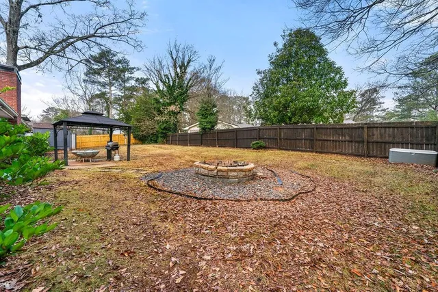 a view of a backyard with a trampoline