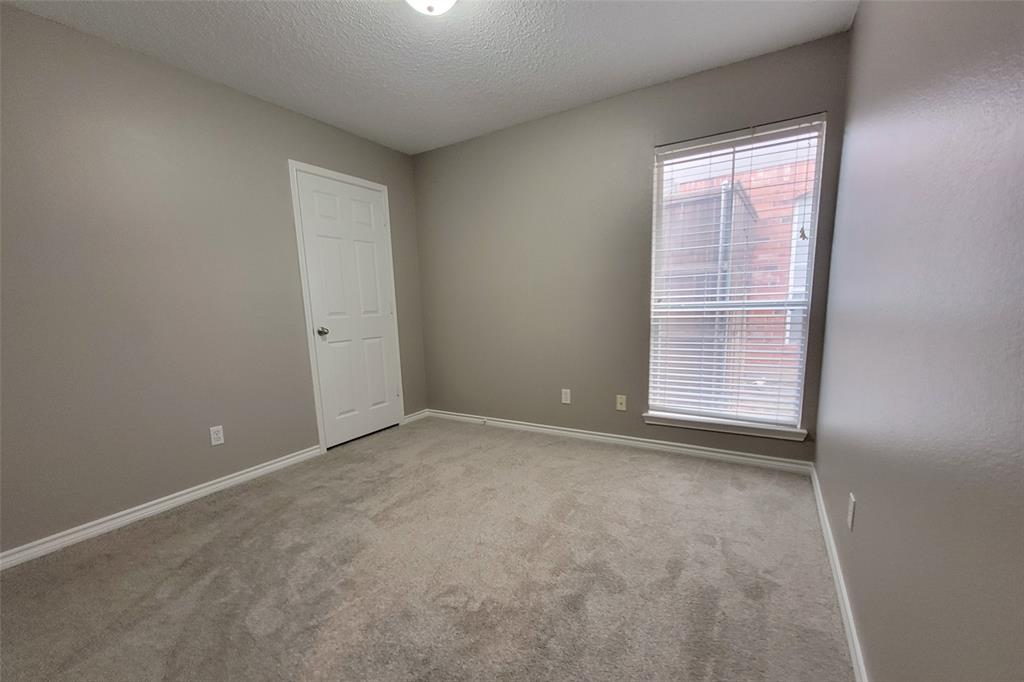 1604 Knoll Ridge Circle Corinth, TX 76210 - Photo 30 of 37 Neutral gray wall paint with white baseboards and trim