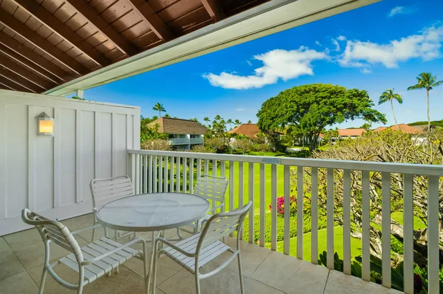 a view of a chairs and table in patio