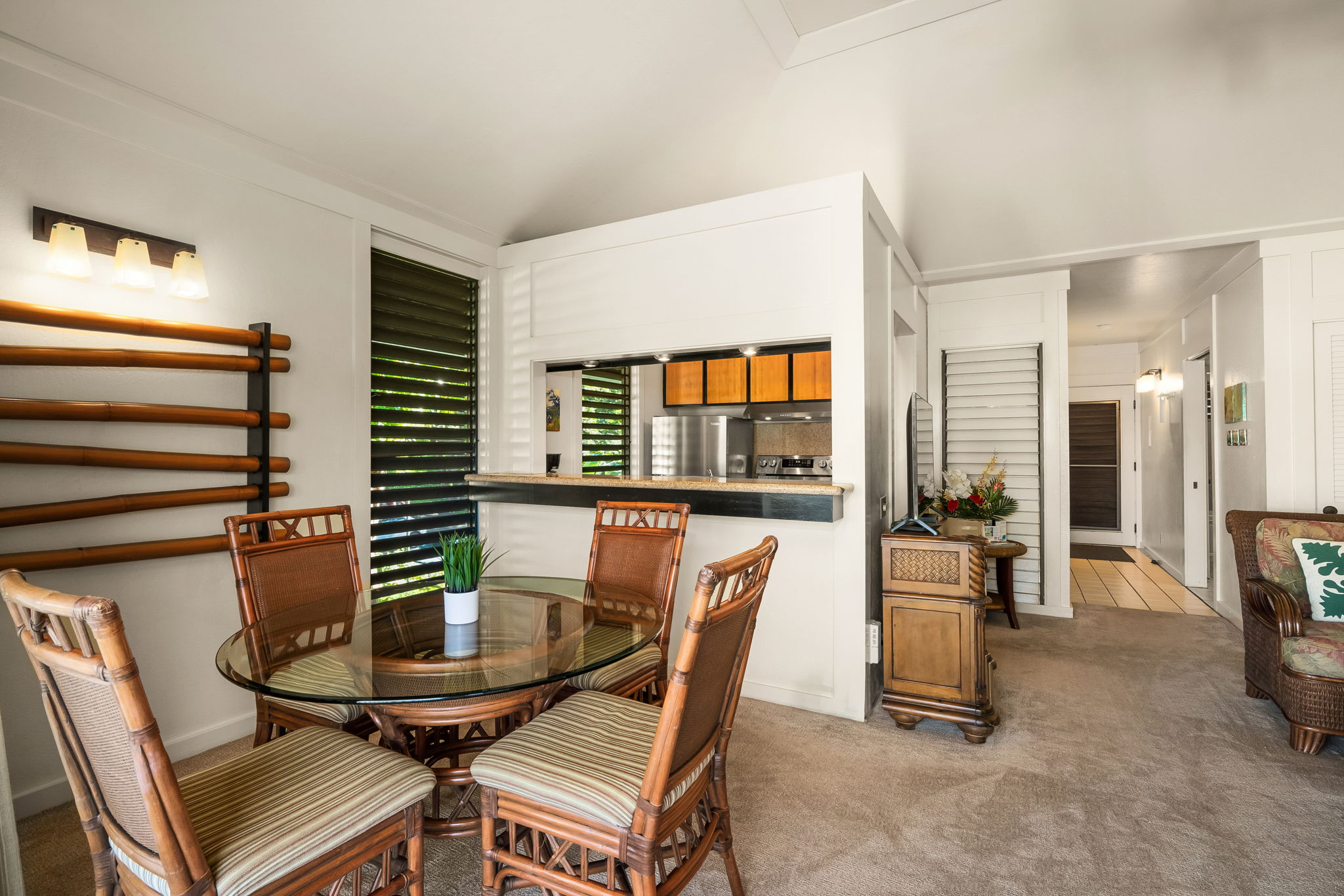 2253 Poipu Road, Unit 55 Koloa, HI 96756 - Photo 11 of 21 a dining room with furniture and wooden floor