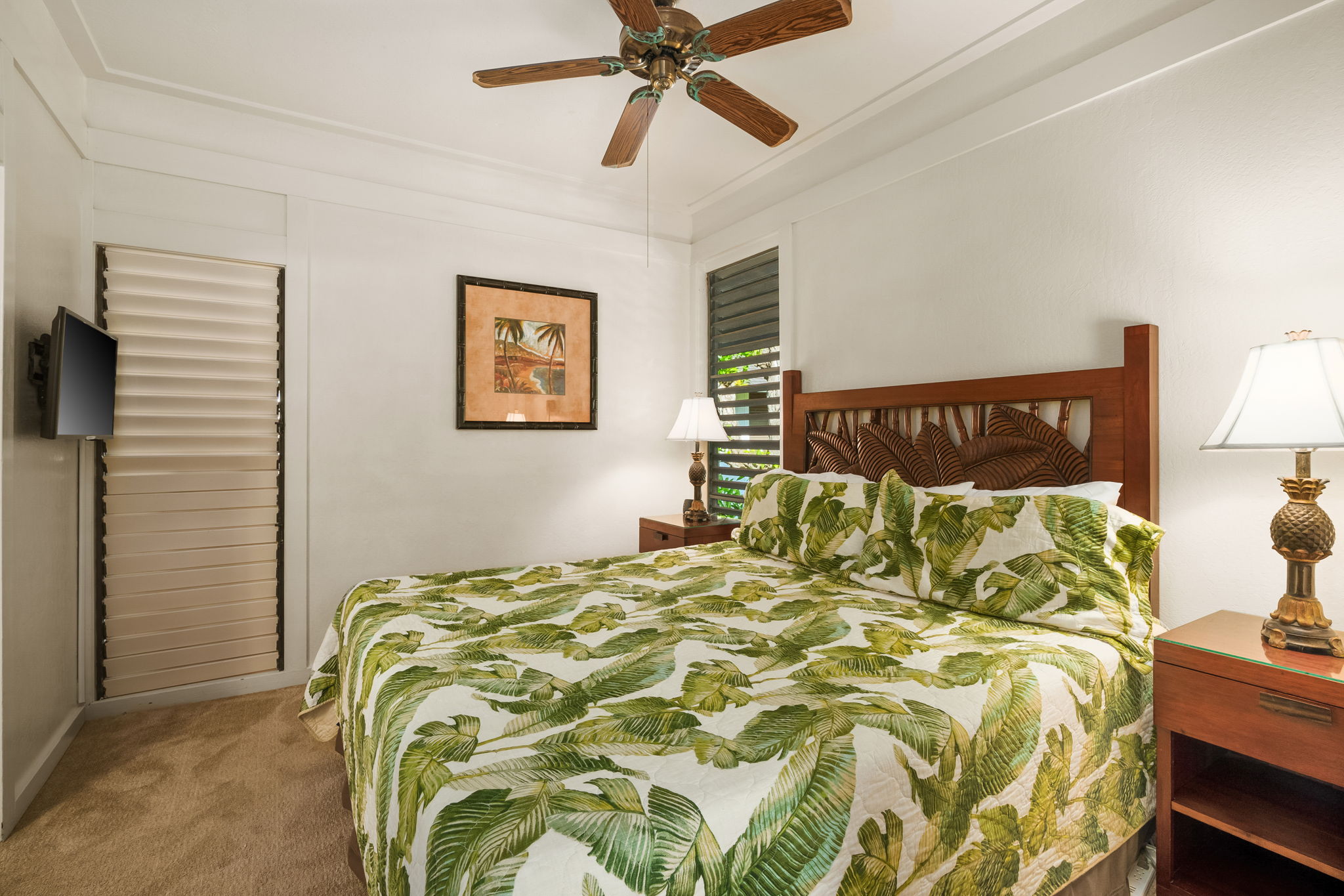 2253 Poipu Road, Unit 55 Koloa, HI 96756 - Photo 13 of 21 a bed sitting in a bedroom next to a window