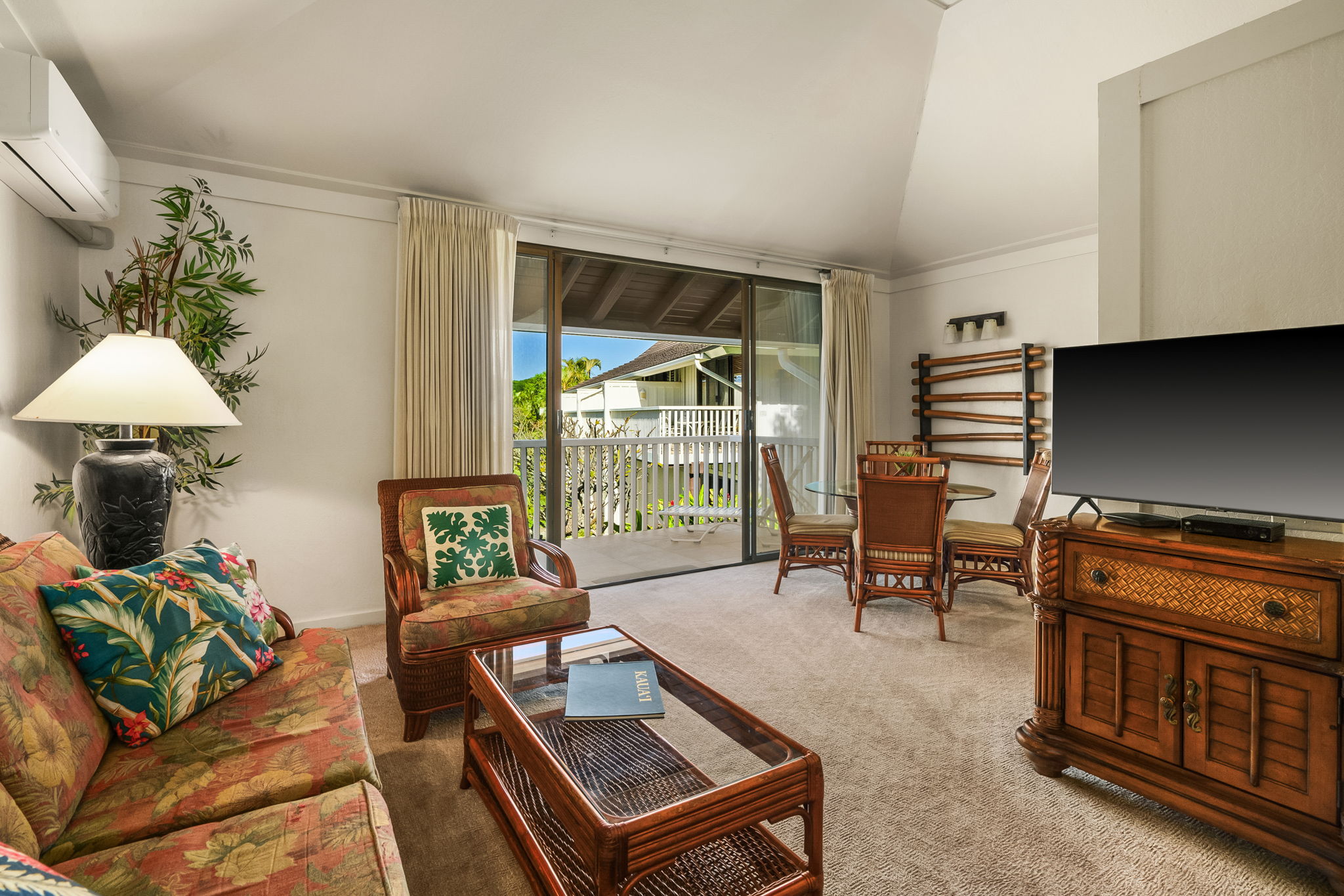 2253 Poipu Road, Unit 55 Koloa, HI 96756 - Photo 2 of 21 a living room with furniture and a flat screen tv
