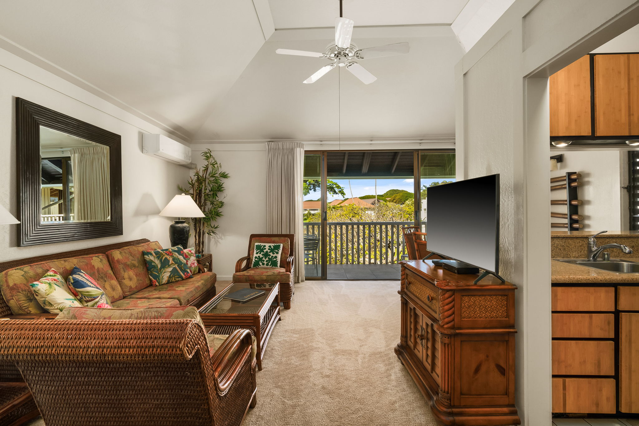 2253 Poipu Road, Unit 55 Koloa, HI 96756 - Photo 9 of 21 a living room with furniture a window and a flat screen tv