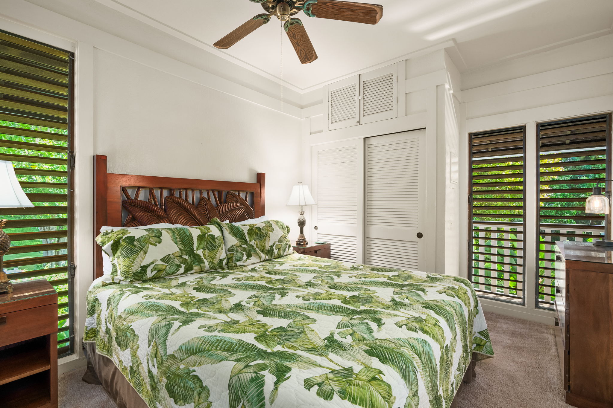 2253 Poipu Road, Unit 55 Koloa, HI 96756 - Photo 9 of 21 a bed sitting in a bedroom next to a window