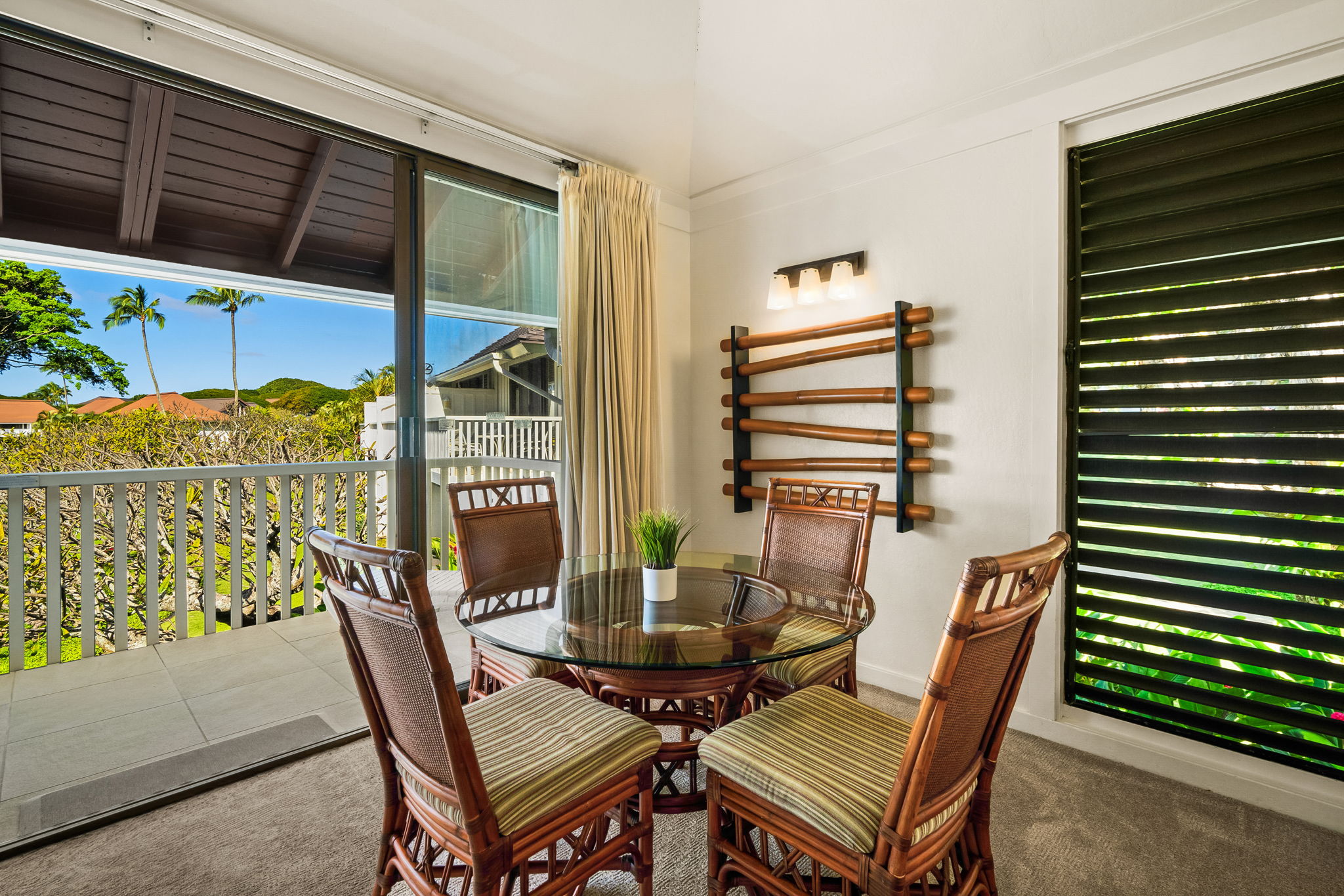 2253 Poipu Road, Unit 55 Koloa, HI 96756 - Photo 10 of 21 a balcony with table and chairs