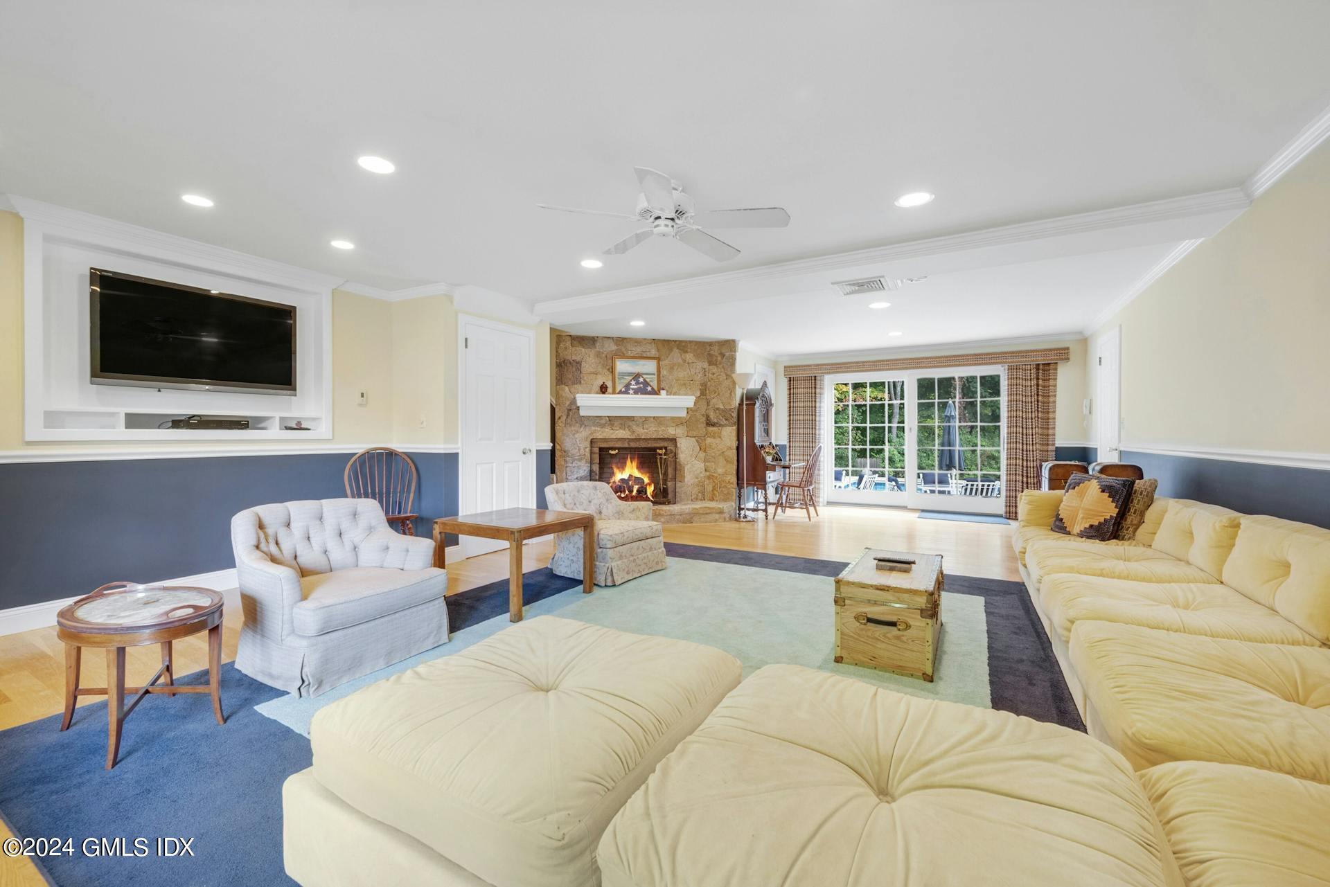 75 Bowman Drive Greenwich, CT 06831 - Photo 16 of 22 a living room with furniture and a flat screen tv
