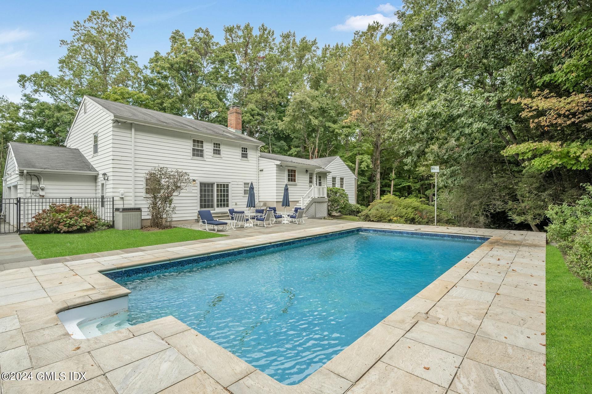 75 Bowman Drive Greenwich, CT 06831 - Photo 20 of 22 a view of a house with pool