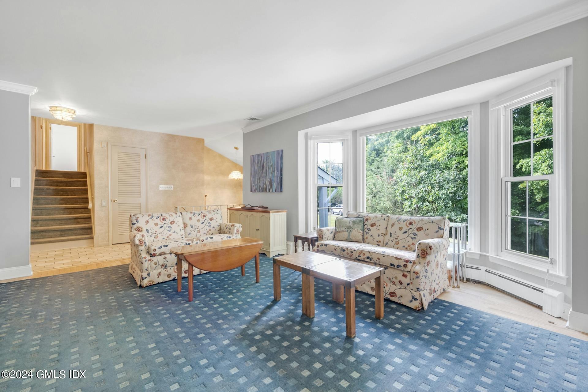75 Bowman Drive Greenwich, CT 06831 - Photo 4 of 22 a living room with furniture and a large window