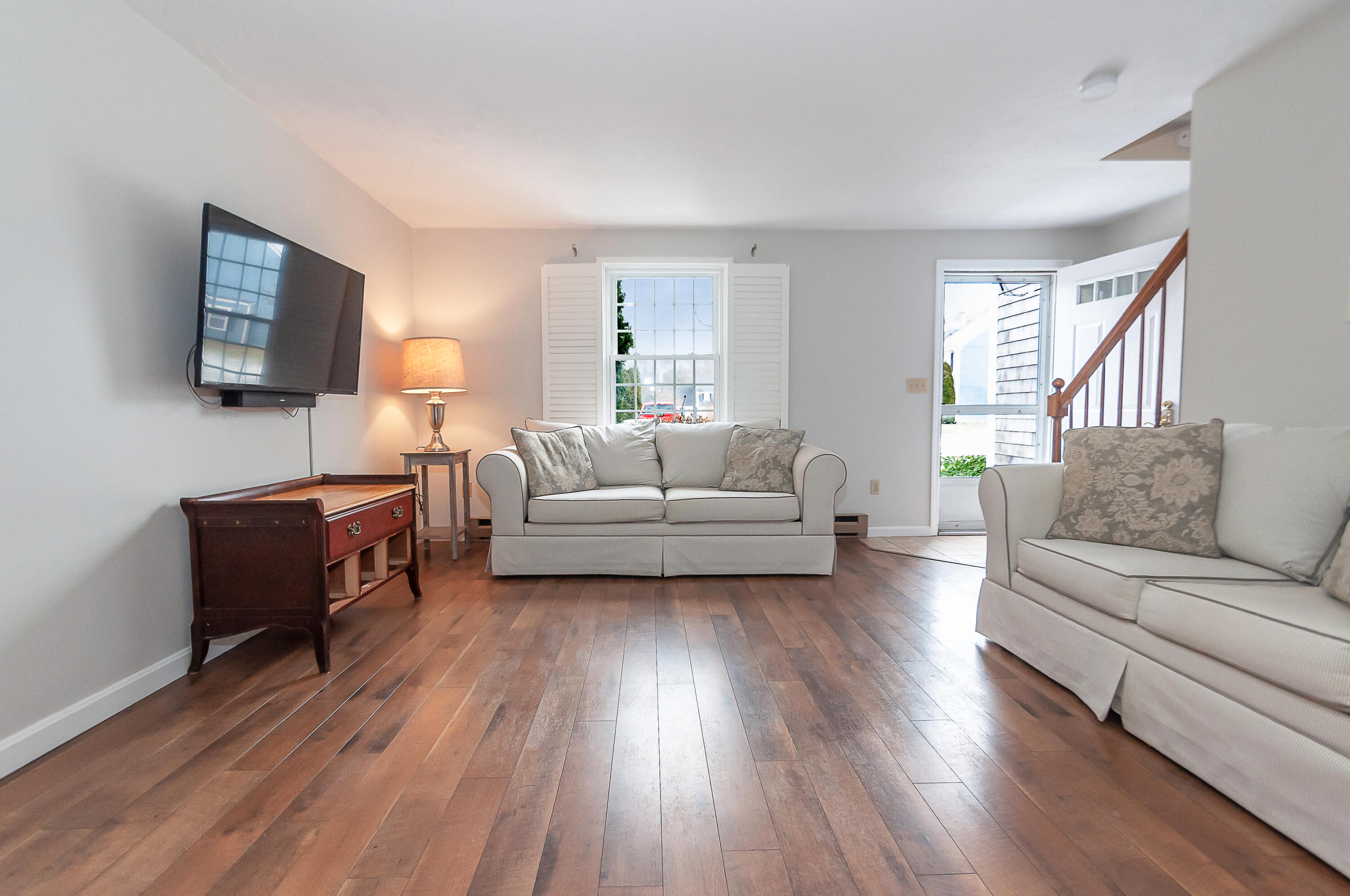 36 Atkins Road, Unit E6 East Sandwich, MA 02537 - Photo 5 of 30 a living room with furniture and a flat screen tv