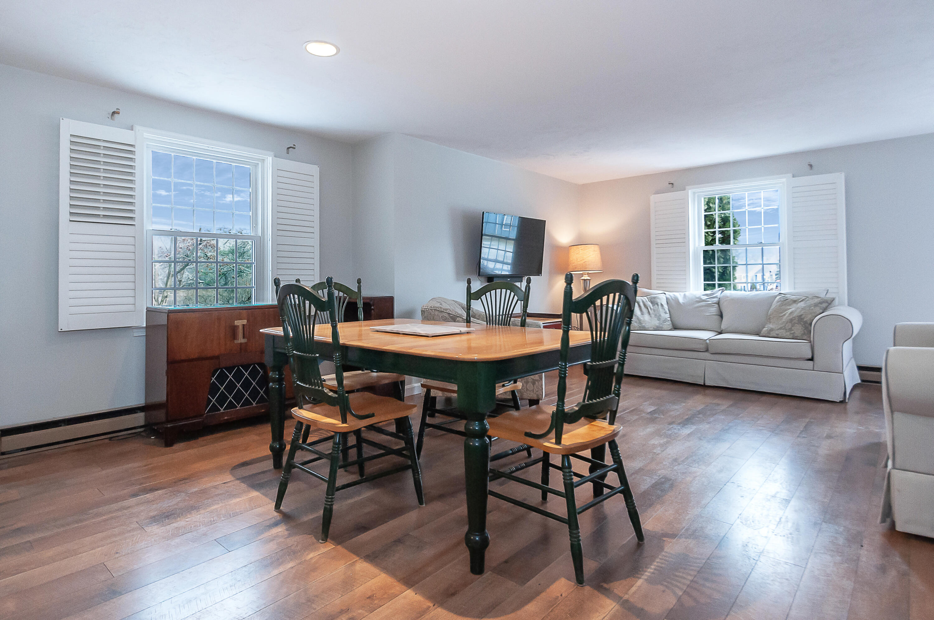 36 Atkins Road, Unit E6 East Sandwich, MA 02537 - Photo 6 of 30 a dining room with furniture and wooden floor