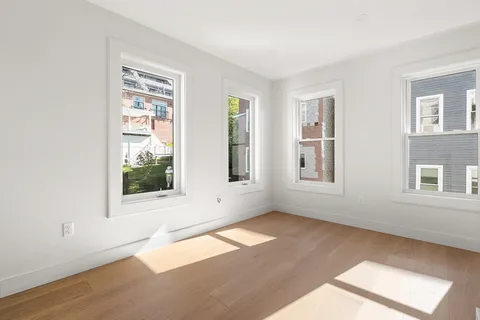 a view of an empty room with a window