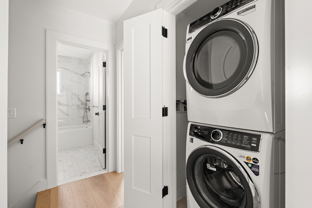 9 Armory Street Boston, MA 02129 - Photo 22 of 37 a view of a hallway with washer and dryer