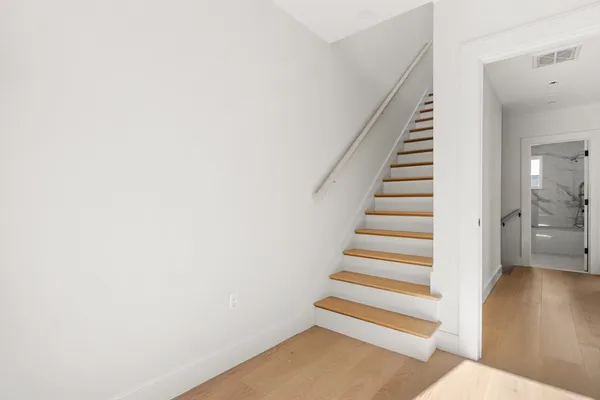 a view of entryway with wooden floor