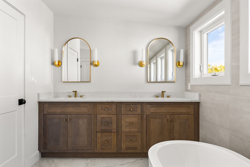 9 Armory Street Boston, MA 02129 - Photo 32 of 37 a bathroom with a toilet sink and mirror