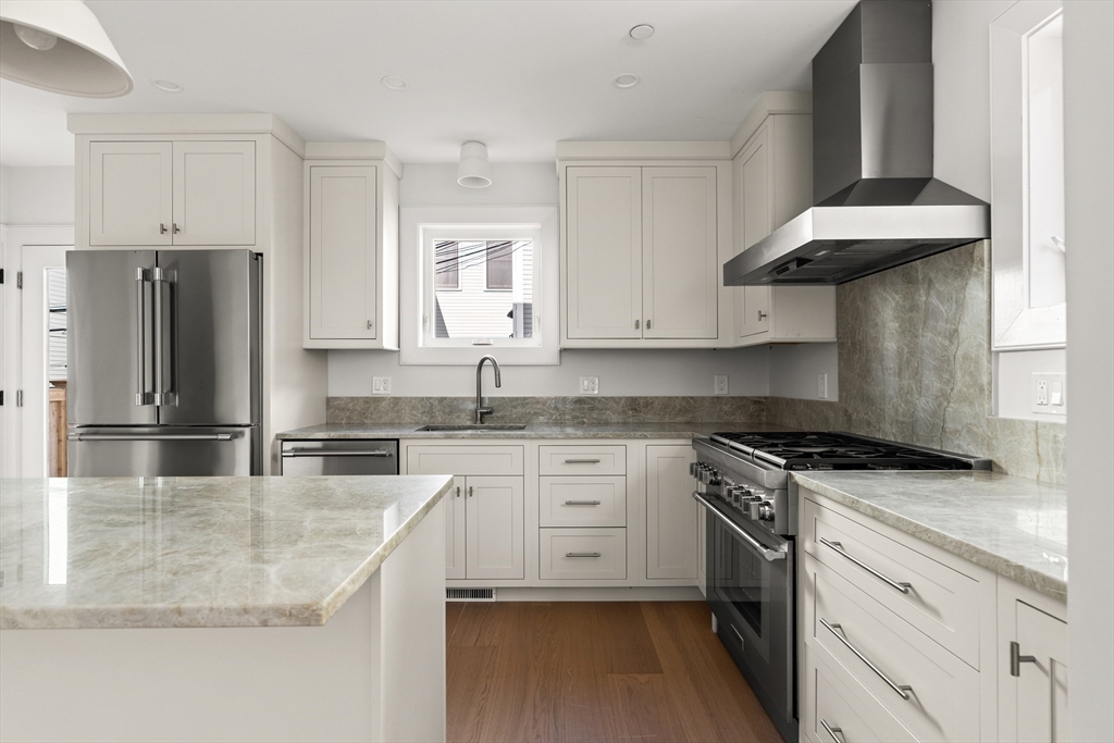 9 Armory Street Boston, MA 02129 - Photo 4 of 37 a kitchen with stainless steel appliances granite countertop a sink stove and refrigerator