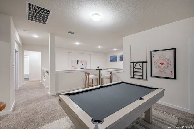 a room with stainless steel appliances lots of counter space and window