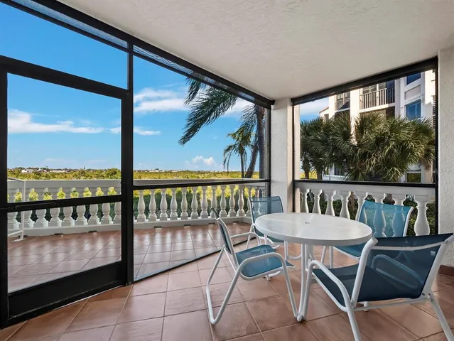 a view of a balcony with furniture