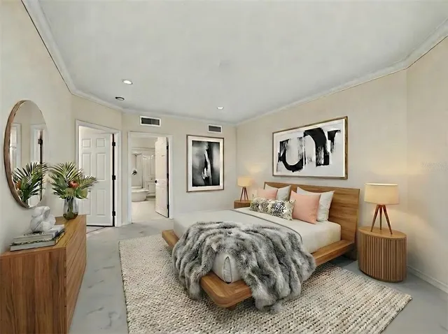 a bedroom with bed and a couch