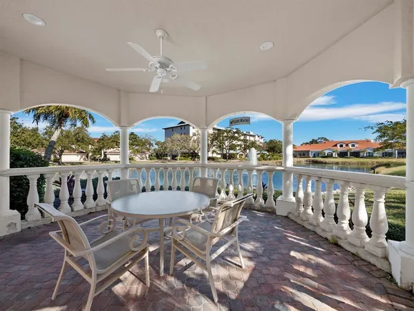 a view of a chairs and table in patio