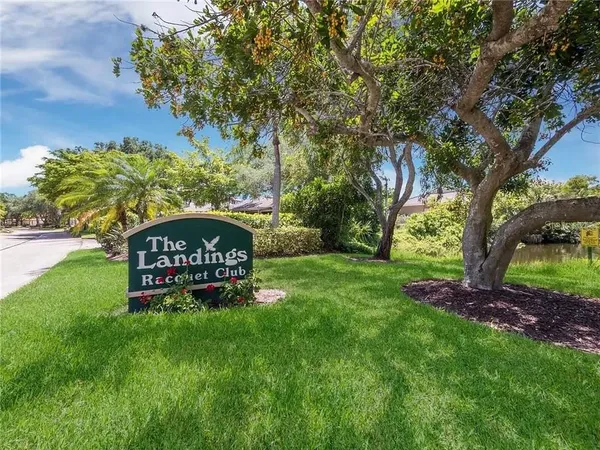 a view of a sign board with a big yard