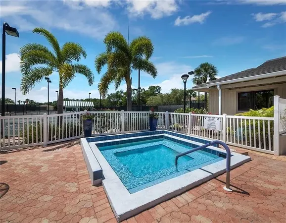 a view of a swimming pool with a deck