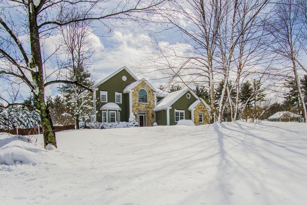 16 Somerset Drive Andover, MA 01810 - Photo 1 of 30 a front view of a house with a yard covered in snow