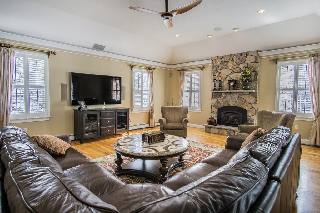 16 Somerset Drive Andover, MA 01810 - Photo 12 of 30 a living room with furniture a fireplace and a flat screen tv