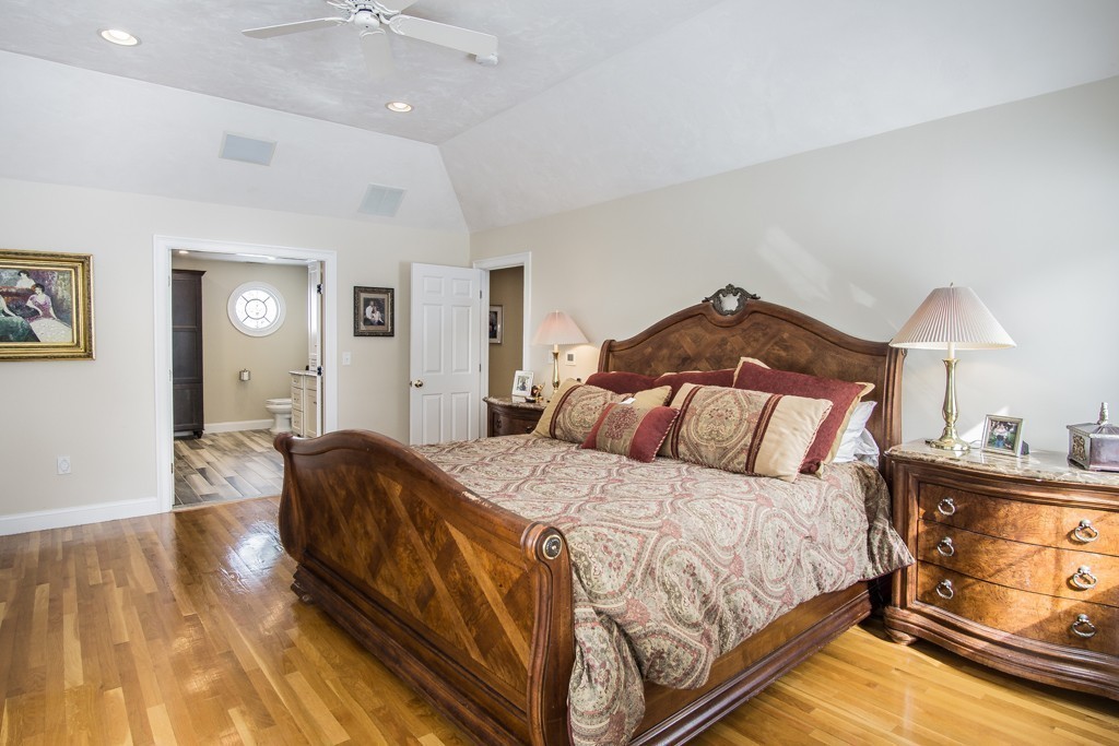 16 Somerset Drive Andover, MA 01810 - Photo 15 of 30 a bedroom with a bed and lamp on dresser