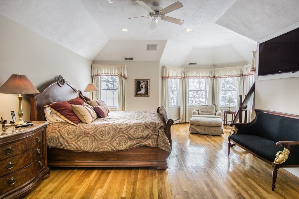 16 Somerset Drive Andover, MA 01810 - Photo 16 of 30 a spacious bedroom with a bed a couch and dresser