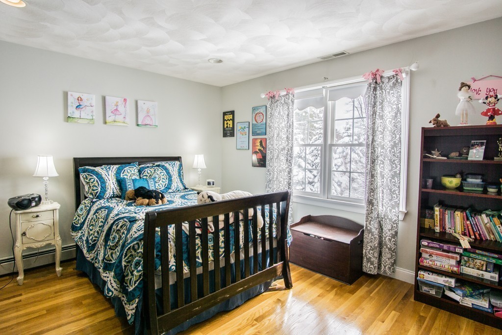 16 Somerset Drive Andover, MA 01810 - Photo 19 of 30 a bedroom with furniture and a book shelf
